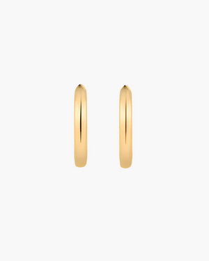 Gold hoop earrings on a white background
