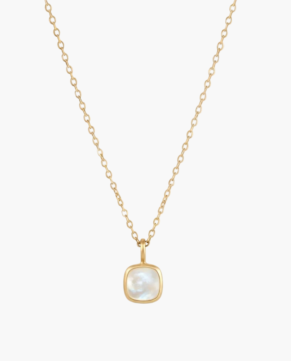Gold necklace with a square pendant on a white background