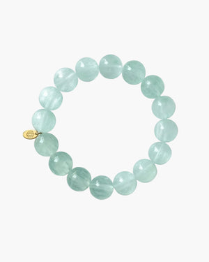 Light aqua green beaded bracelet on a white background