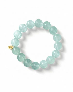Light blue beaded bracelet on a white background