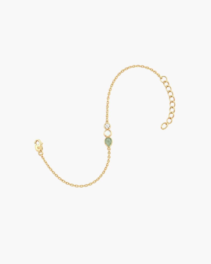Lumenina Aurora Trio gold plated gemstone charm bracelet featuring malachite, white opal, and cubic zirconia.