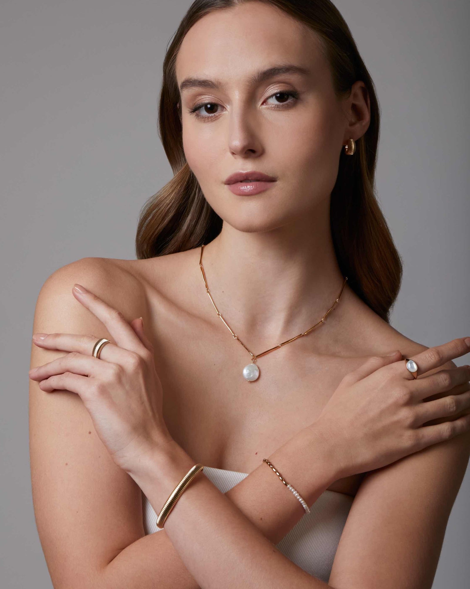 gold plated tube chain necklace with a coin pearl charm