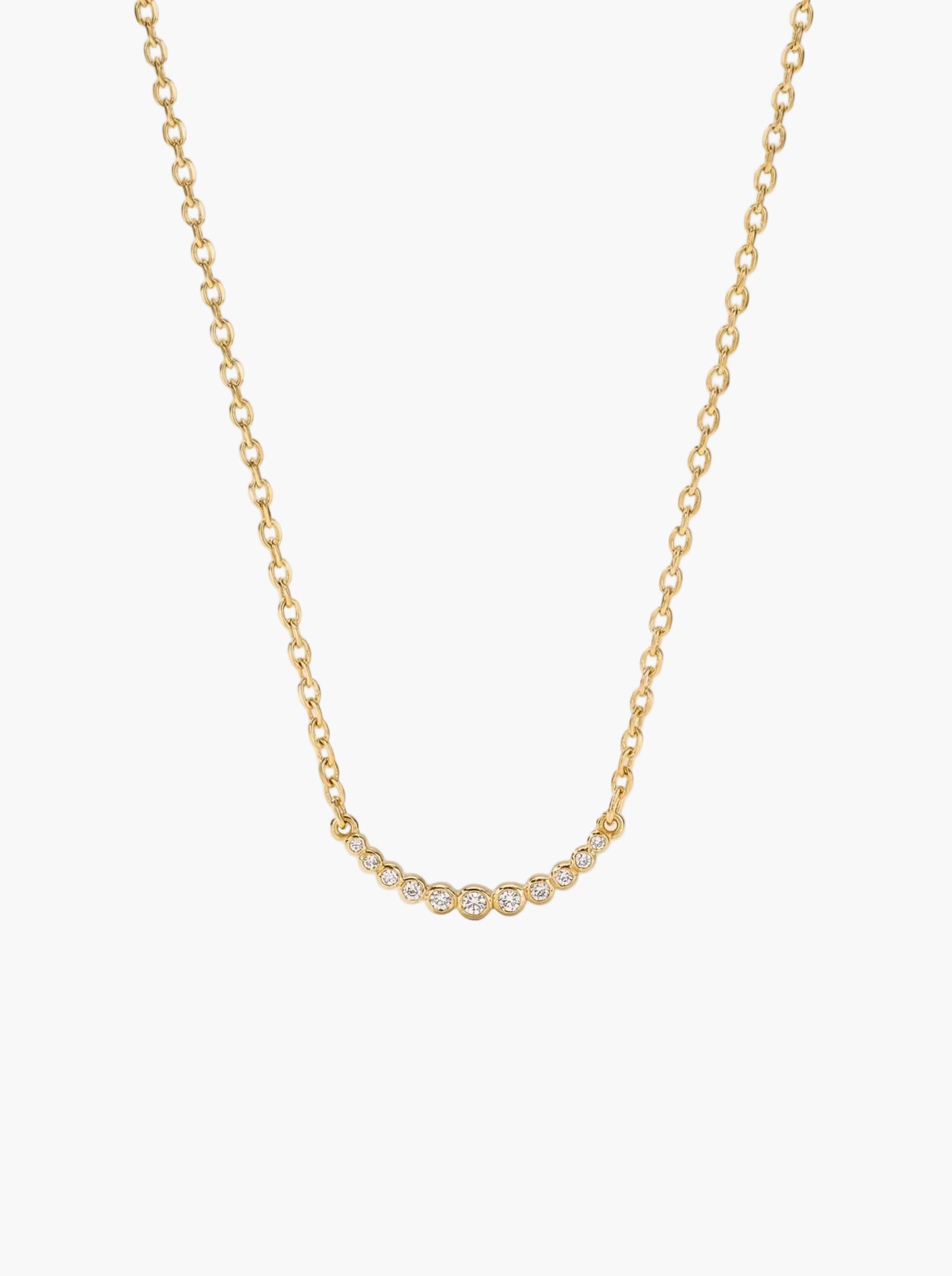 Gold tennis curved bar chain necklace on a light gray background