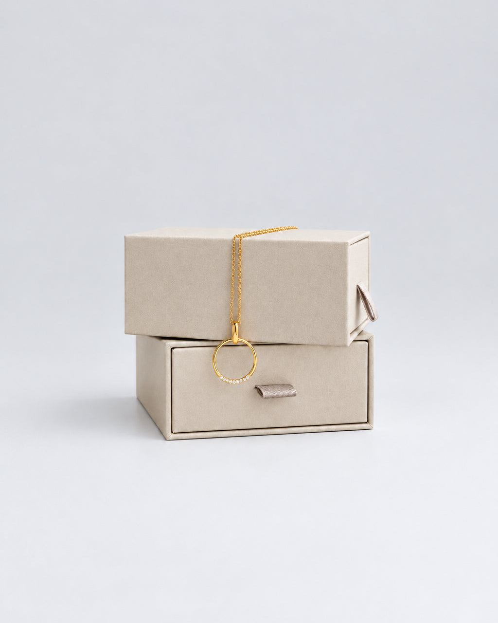 gold ring charm with cubic zirconia stones on a dainty chain