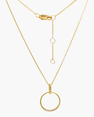 gold ring charm with cubic zirconia stones on a dainty chain