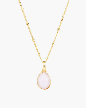 faceted pink opal charm on a gold satellite chain 
