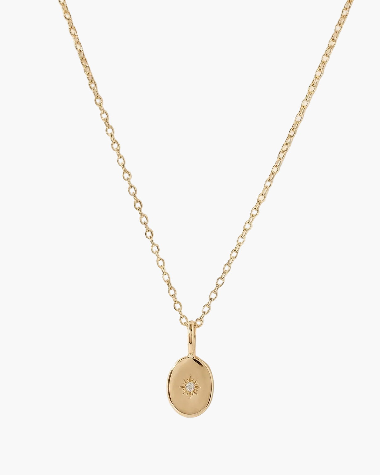 Gold necklace with a small pendant on a white background