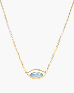 A gold-plated sterling silver chain necklace with a central aquamarine evil eye charm.