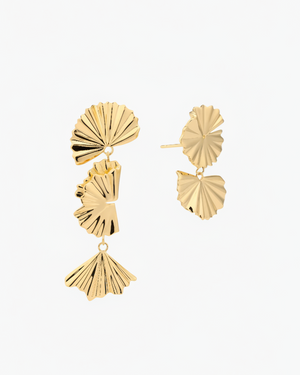 gold leaf mix and match drop earrings on a neutral background