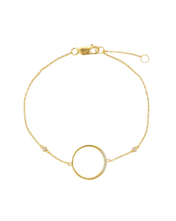 Gold bracelet with a circular design on a white background