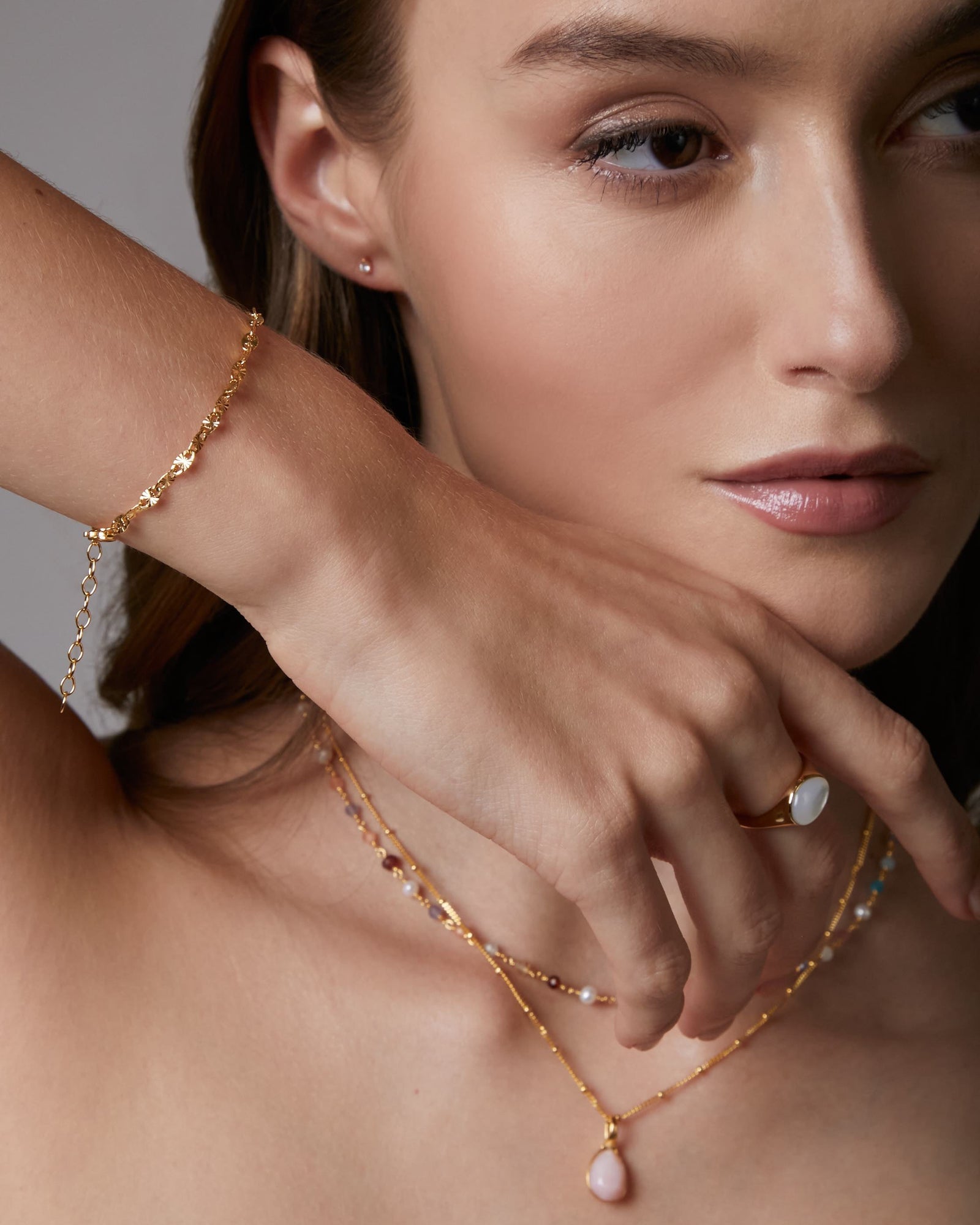 Gold chain bracelet on a white background
