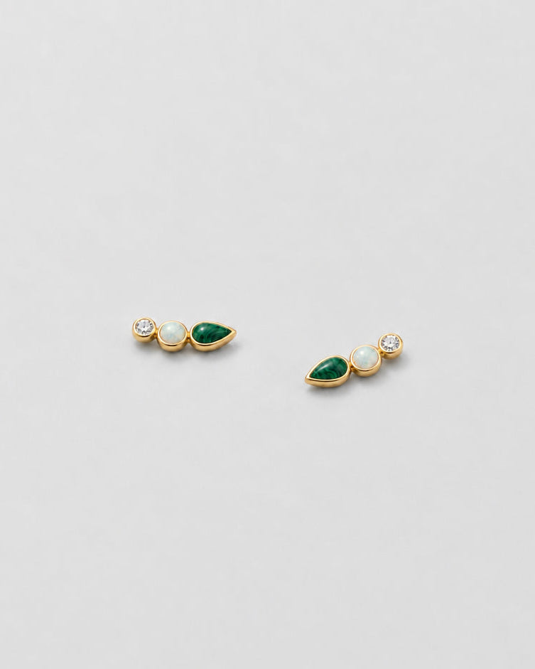 A pair of gold stud earrings featuring green teardrop-shaped stones, round white opal-like stones, and small clear gemstones, displayed on a clean white background.