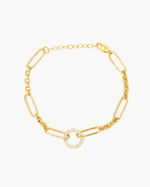 Gold bracelet with a circular design on a white background