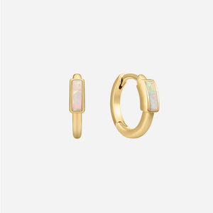 Gold hoop earrings with opal stones on a white background