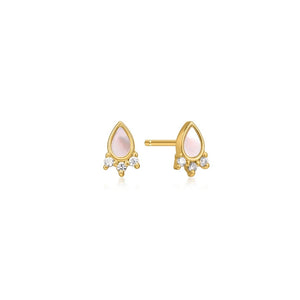Gold earrings with synthetic opal gemstones on a white background
