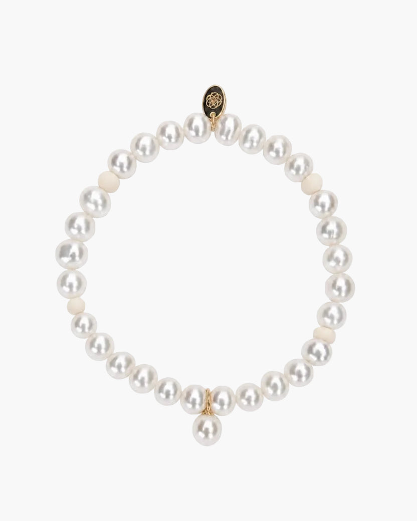 pearl bracelet on a light grey background