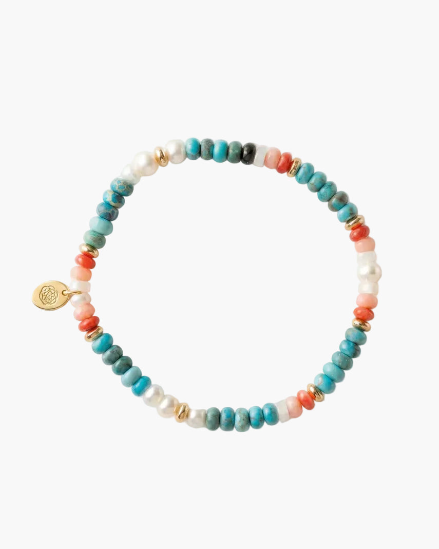 Multicolored beaded bracelet on a light gray background