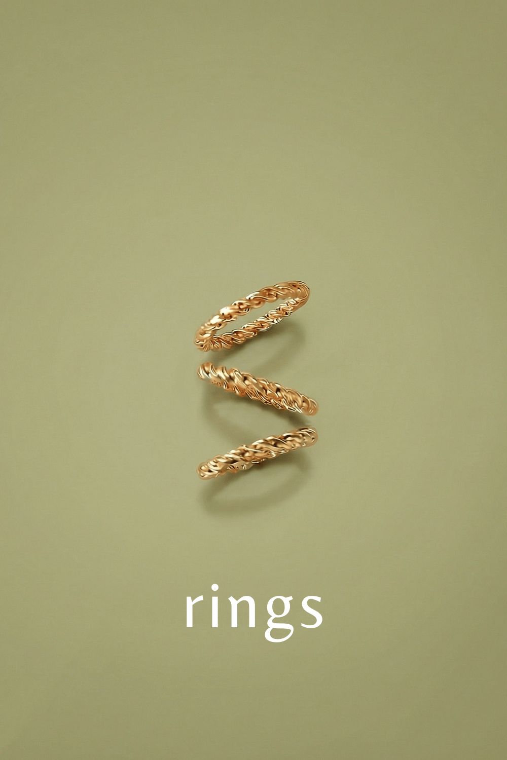 Three Gold twisted rings on a green background with 'rings' text.