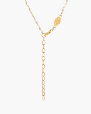 backside of baguette citrine necklace in vermeil gold on white background
