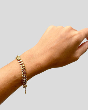 arm with gold vermeil bold curb chain bracelet