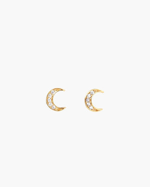 crescent moon studs on light grey background