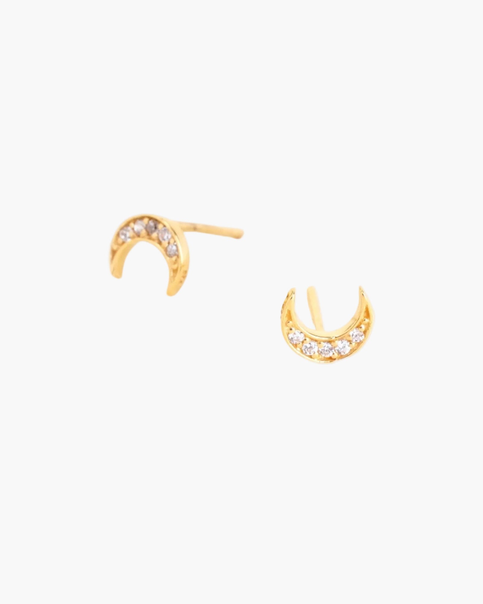 crescent moon studs on light grey background