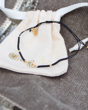gold dipped evil eye black friendship bracelet