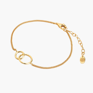 interlocking double ring chain bracelet on grey background