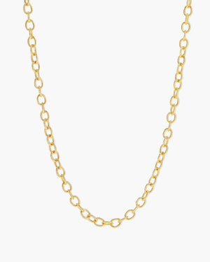 gold textured cable chain necklace on a light grey background